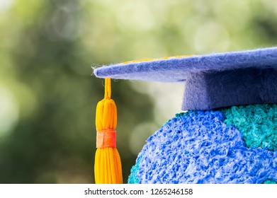 Education World Or Graduated Study Abroad International Ideas. Graduation Hat On Top Paper Mache Craft Earth Globe. Concept Of Congratulations To Graduates University Lead To Success In World Amd Life