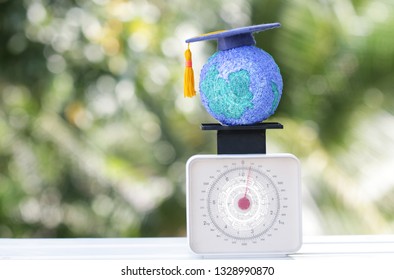 Education World Or Graduated Study Abroad International Ideas. Graduation Hat On Top Paper Mache Craft Earth Globe Scales Balance. Concept Of Congratulations To Graduates University Lead To Success