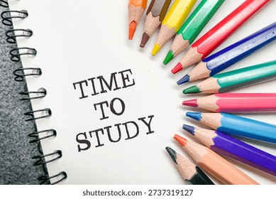 Educational concept featuring a spectrum of sharp colored pencils surrounding 