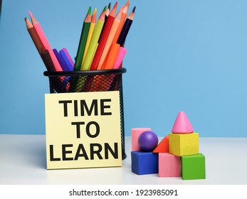 Educational concept. Phrase TIME TO LEARN written on sticky note with colorful blocks and stationary.