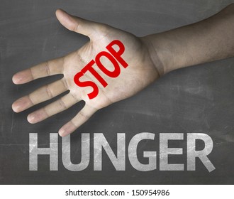 Educational And Creative Composition With The Message Stop Hunger On The Blackboard