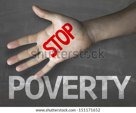 Educational and Creative composition with the message Stop Poverty on the blackboard 