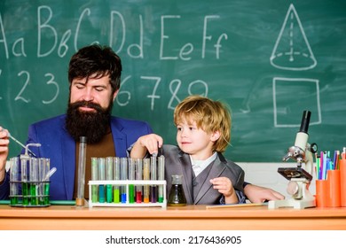 Educational School Program. Teacher And Child Test Tubes. Perseverance Pays Off. Chemical Experiment. Symptoms Of ADHD At School. Schoolboy Cute Child Experimenting With Liquids. School Lesson