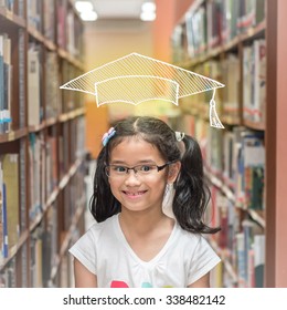 Educational Success Concept With Smart School Kid Student With Imaginary Doodle Graduation Cap In Library
