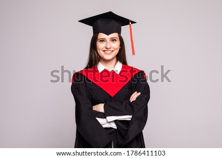 Educational theme: graduating student girl in an academic gown. Isolated over white background.