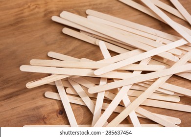 Educative Craft. Popsicle Sticks On Wooden Desk. Shallow Depth Of Field.