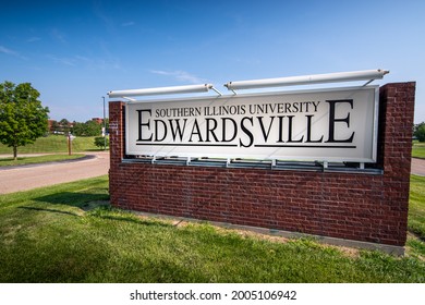 Edwardsville, IL—July 7, 2021; Brick Sign Alongside Road With Campus Buildings In Background Identifies Location Of Southern Illinois University Edwardsville.