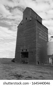 Edwin, Manitoba / Canada - September 6 2016 : Showing An Old Grain Elevator, On The Edge Of A Small Town, In Black And White.