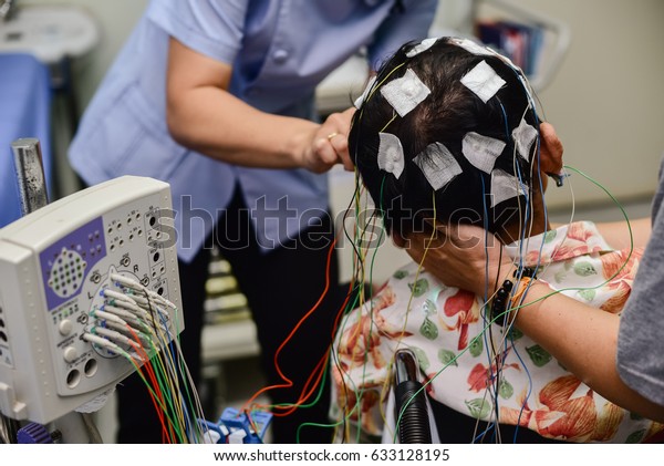 Eeg Electrode Placement Patient During Eeg Stock Photo 633128195 ...