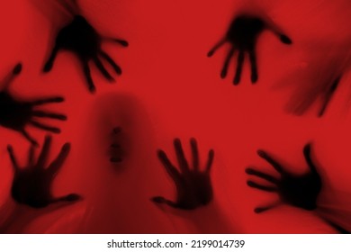 eerie blurry hands of people as if they have been trapped behind glass, dense fabric, wrap, ghost, spirit trying to reach out from afterlife, concept of violence, nightmares, halloween horror - Shutterstock ID 2199014739