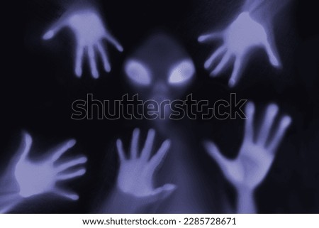 eerie blurry image of humanoids from other planets, frightening creatures that appear as if they have been trapped behind glass, dense fabric, wrap, alien trying to reach out from afterlife