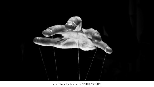 Eerie puppeteer hands controlling you. Manipulation concept