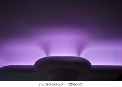 Eerie Purple Glow Lighting In Dark Room Similar Appearance  To A Blacklight