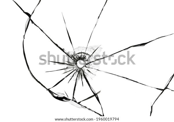 The effect of cracks on broken\
glass from a shot of a weapon. A hole in the glass of the\
bullet