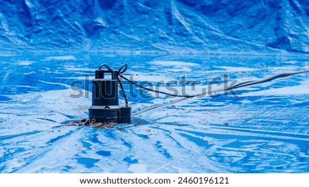 Effective Pool Winterizing with Water Pump on Pool Cover