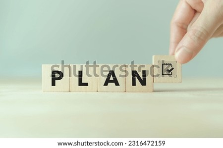 Effective time planning and management concept. Business or project or task planning. Daily plan. PLAN text and timeline management icon on wooden cube blocks on clear background and copy space. 