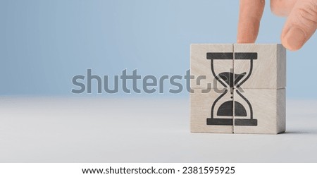 Effective time planning and management concept. Deadline planning and management. hourglass icon on wooden cube blocks. copy space.