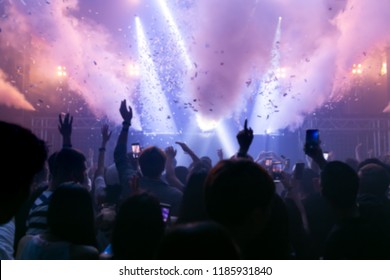 Effects blur Concert, disco dj party. People with hands up having fun - Shutterstock ID 1185931840