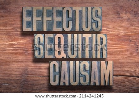 Effectus sequitir causam (Every why has a wherefore) Latin phrase combined on vintage varnished wooden surface 