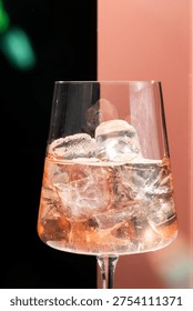 Effervescent elixir twinkles within a crystal chalice, capturing the gossamer allure of summer solstice cocktail hour reverie