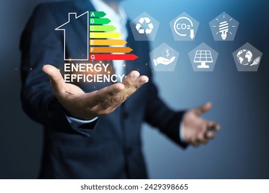 efficiency rating label with businessman improve electric household appliance and building for energy save reduce power consumption to complied with zero CO2 emission - Powered by Shutterstock