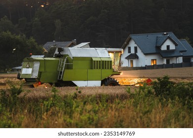 Efficient Agricultural Operations. Machinery Cultivating Fields and Harvesting at Sunset. Rural landscape. - Shutterstock ID 2353149769