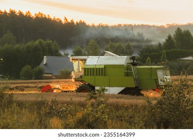 Efficient Agricultural Operations. Machinery Cultivating Fields and Harvesting at Sunset. Rural landscape. - Shutterstock ID 2355164399