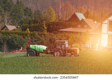 Efficient Agricultural Operations. Machinery Cultivating Fields and Harvesting at Sunset. Rural landscape. - Shutterstock ID 2356505847