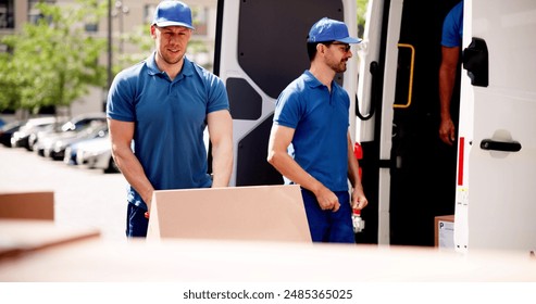 Efficient Delivery Team Transporting Warehouse Supplies: Business Chain Logistics in Action with Smiling Movers Unloading Cardboard Boxes from Truck