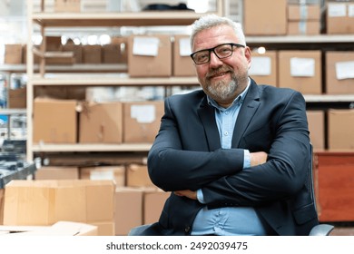 	
Efficient Factory Management: Portrait of Smiling Senior Manager Businessman or CEO in Industrial Factory Warehouse. - Powered by Shutterstock