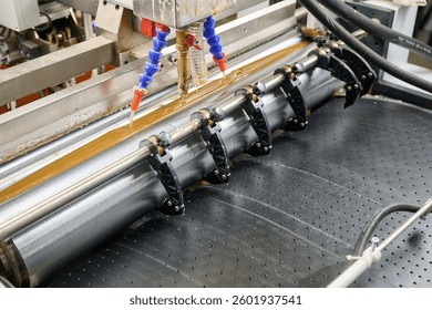 Efficient glue applicator in action during an automated manufacturing process for seamless adhesion