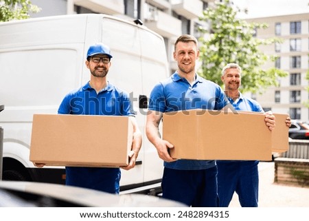 Efficient Truck Movers Transporting Boxes for House Relocation with a Professional Driver and Certified Hardware Installer in Blue.