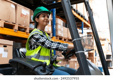 Efficient Warehouse Operations: Female Forklift Driver Poses and Drives Worklift at Distribution Warehouse - Powered by Shutterstock