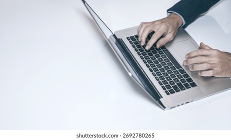 Efficient Work Flow: A High-Angle View of a Professional Typing on a Laptop