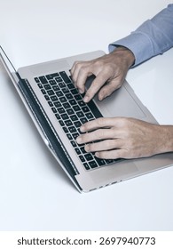 Efficient Work Flow: A High-Angle View of a Professional Typing on a Laptop