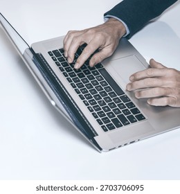 Efficient Work Flow: A High-Angle View of a Professional Typing on a Laptop