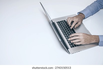 Efficient Work Flow: A High-Angle View of a Professional Typing on a Laptop