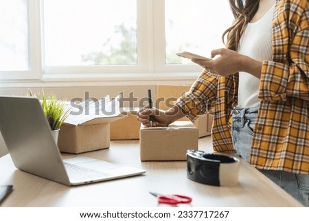Efficiently preparing packages for seamless shipping. The hands of an online store meticulously pack and protect products, ensuring a smooth fulfillment process for satisfied customers worldwide.