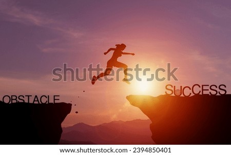 Effort and commitment to success. Silhouette of woman jumping over a cliff to reach success with evening sunlight. concept of setting goals for success and effectively solving problems and obstacles