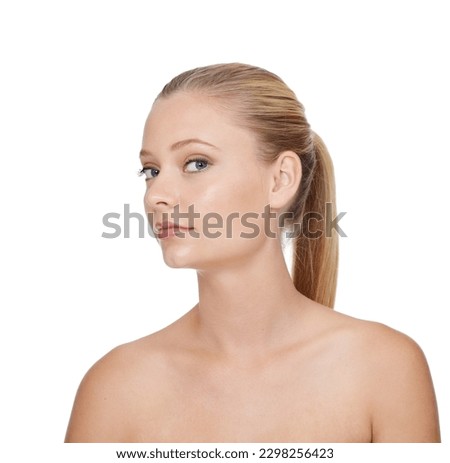 Effortless beauty and flawless skin. A young blonde woman smiling at the camera while isolated on white.