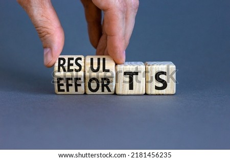 Efforts and results symbol. Concept words Efforts and results on wooden cubes. Businessman hand. Beautiful grey table grey background. Business efforts and results concept. Copy space.