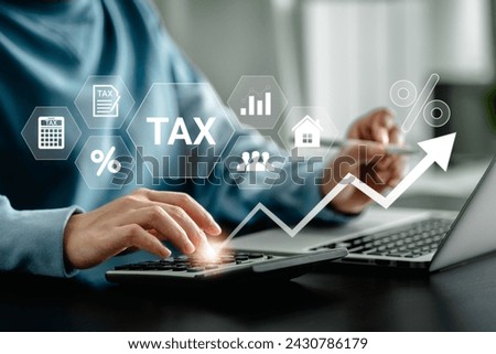 E-Filing, Taxpayer using a laptop to file taxes personal income, Tax Return form online for tax payment. Government, state taxes. Data analysis, paperwork, reports. Calculation tax return.