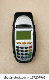 A eftpos machine on a plain background