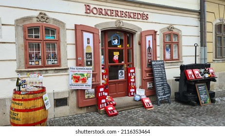 Eger, Hungary – December 29, 2021: A wine store in a traditional street in the old town of Eger. 
