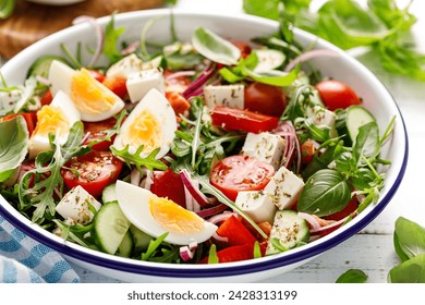 Egg and arugula fresh vegetable salad with feta cheese - Powered by Shutterstock