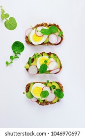 Egg And Avocado Sandwich Isolated. Avocado And Egg Toast On The White Background. Top View Toast