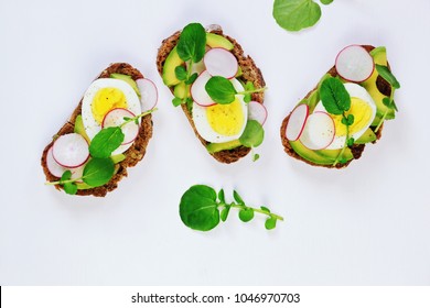 Egg and avocado sandwich isolated. Avocado and egg toast on the white background. Top view toast