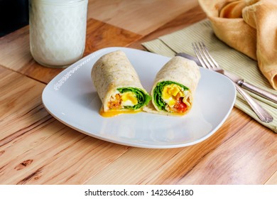 Egg And Bacon American Breakfast Sandwich Wrap With A Glass Of Milk