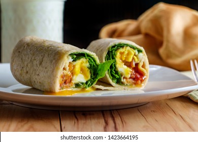 Egg And Bacon American Breakfast Sandwich Wrap With A Glass Of Milk