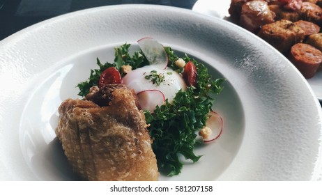 Egg Benedict Salad With Fried Chicken In Italian Restaurant At Thailand.